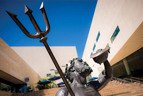 Triton statue on campus at UC San Diego - Triton holds a conch shell and trident